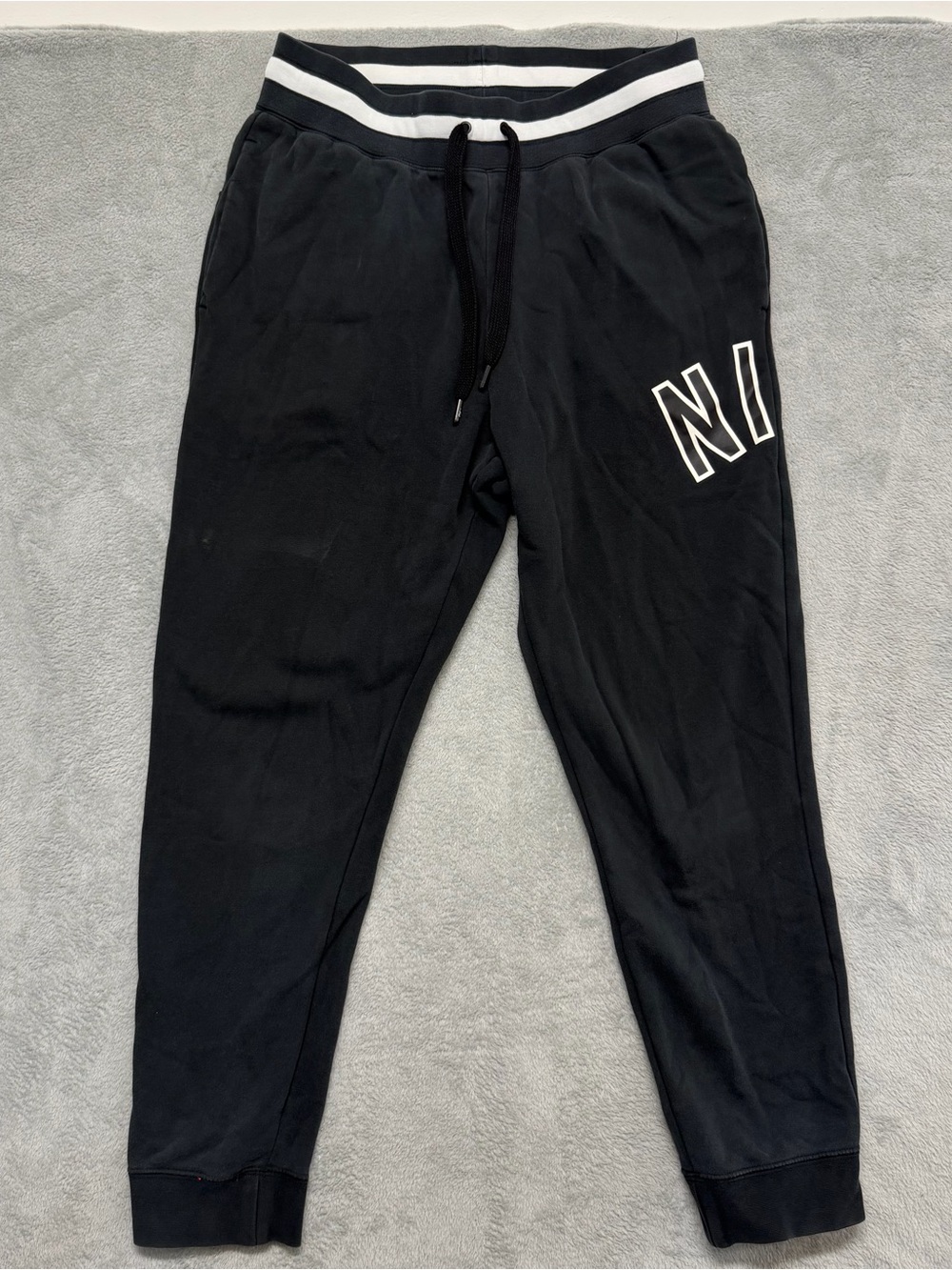 Nike Air Mens Large Black Fleece Jogger Sweatpants Spellout Logo Athletic CN9127